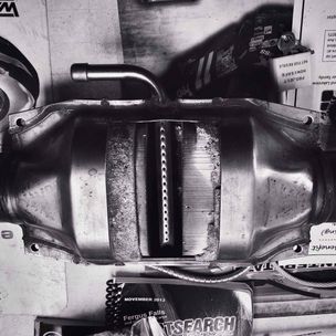 'Muffler At Big Johns' by Zack Schuster